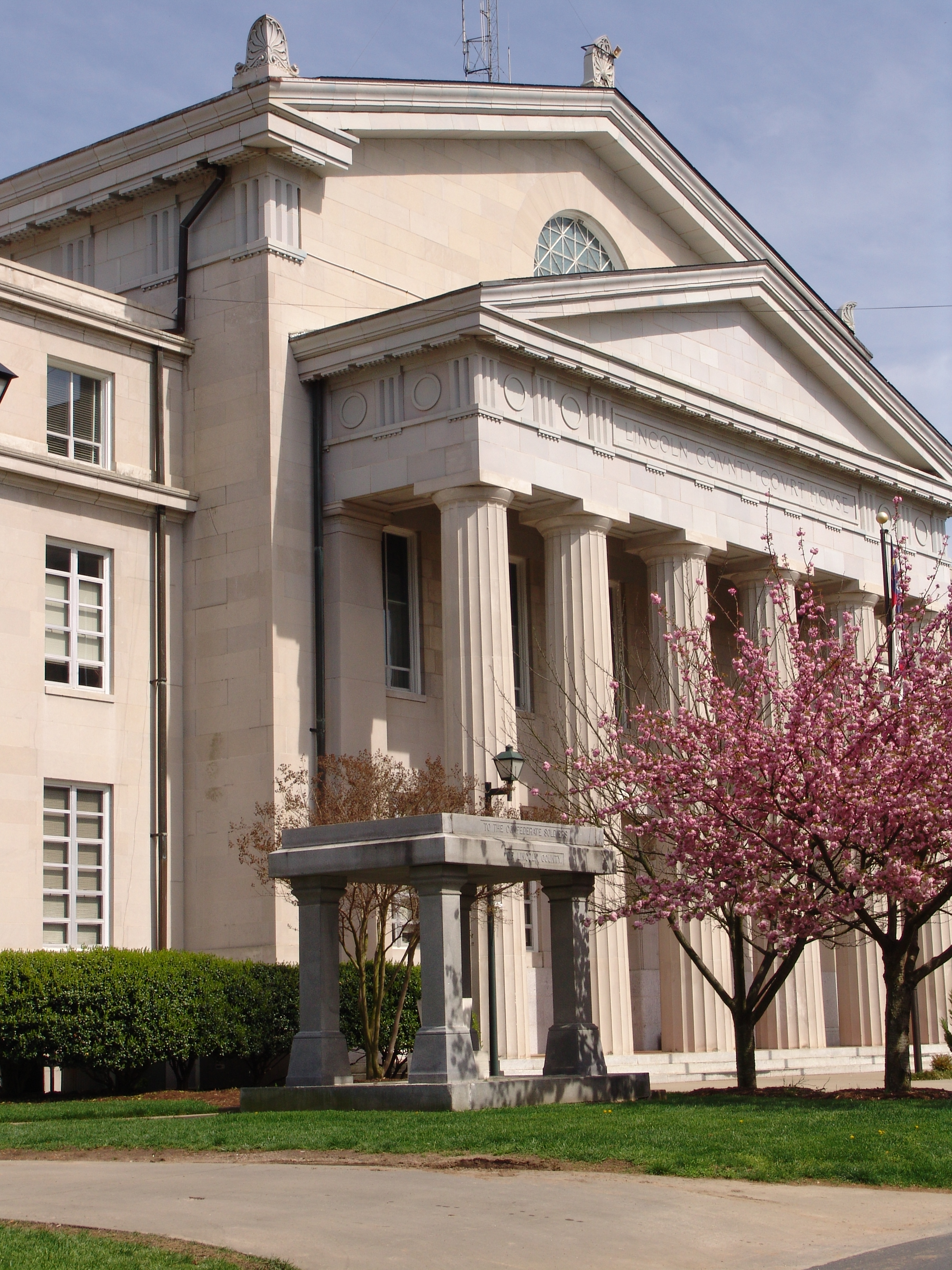 Front of pillared building during spring